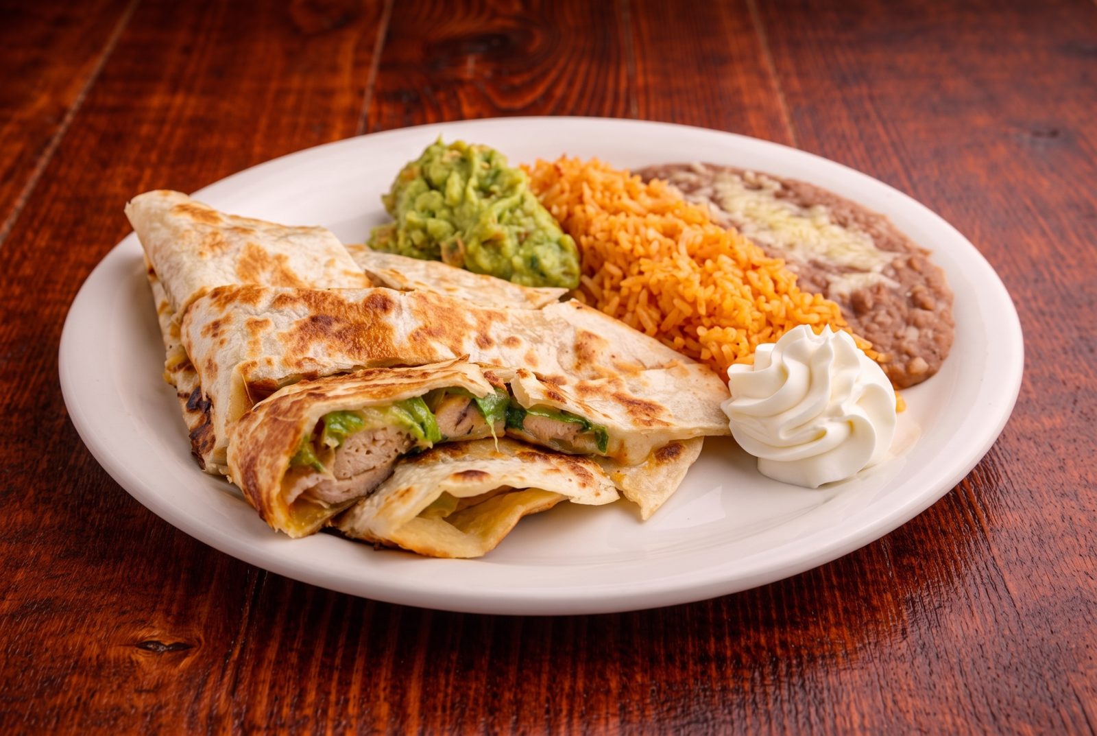 Chicken quesadillas with guacamole, rice and beans